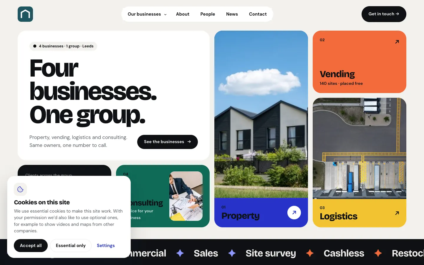 The sample Group home page with the cookie banner at the bottom left: "Cookies on this site. We use essential cookies to make this site work. With your permission we'd also like to use optional ones, for example to show videos and maps from other companies." with Accept all, Essential only and Settings buttons